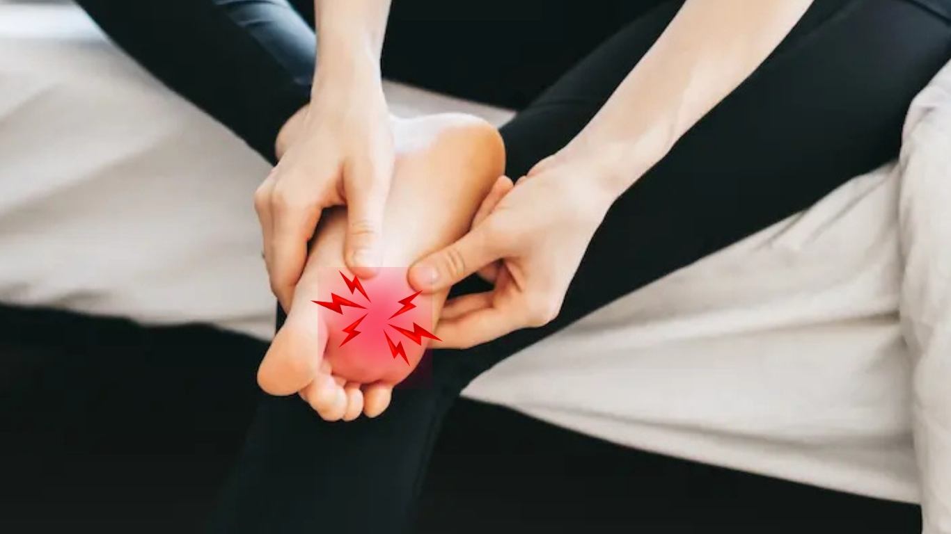 person holding barefoot with red mark and jagged red lines at ball of the foot