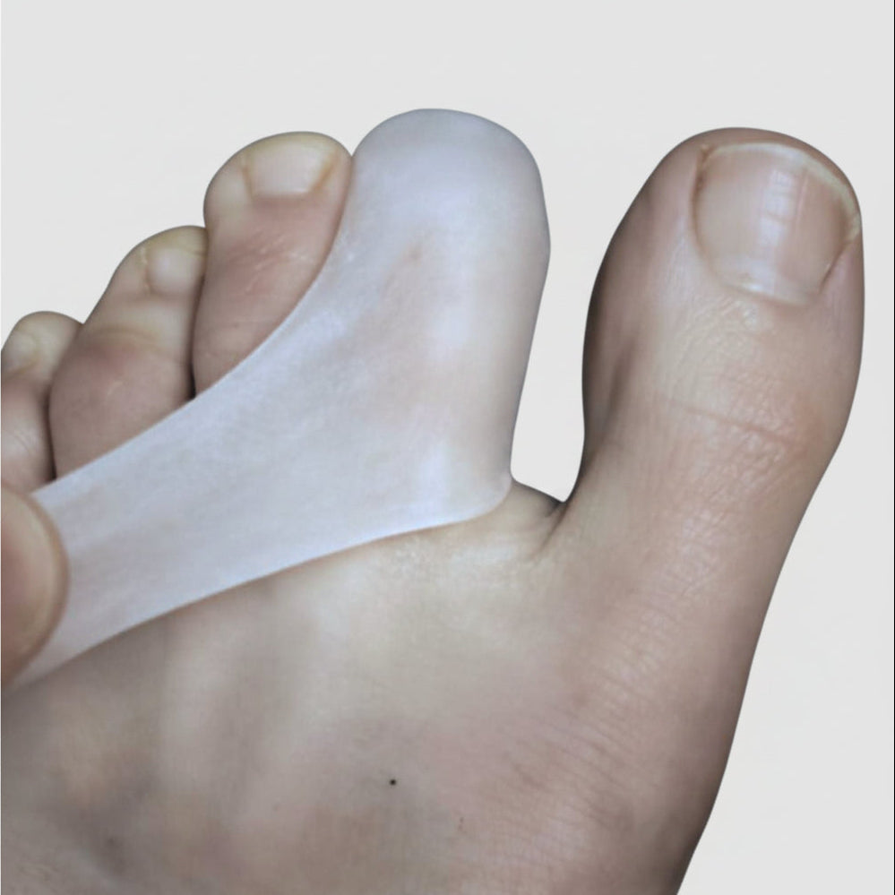 Gel Toe cap on 2nd toe being pulled downward on wood floor - DrGaffneyBestFoot
